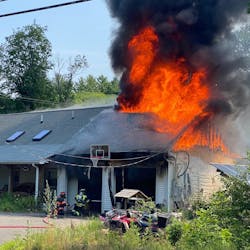 A firefighter suffered minor injuries battling a fire that was sparked by a barbecue smoker's exploding propane tank Thursday. A firefighter suffered minor injuries battling a fire that was sparked by a barbecue smoker's exploding propane tank Thursday.