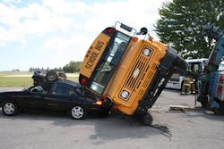 Rescuers must stabilize in place a school bus that is rolled partially onto another vehicle. Otherwise, any movement can worsen the dynamics of the situation. Rescuers must stabilize in place a school bus that is rolled partially onto another vehicle. Otherwise, any movement can worsen the dynamics of the situation.