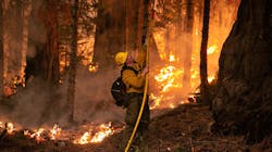 A firefighter works a controlled burn on a ridge near Hwy. 50 in Strawberry, CA, on Saturday, Aug. 28, 2021. A firefighter works a controlled burn on a ridge near Hwy. 50 in Strawberry, CA, on Saturday, Aug. 28, 2021.