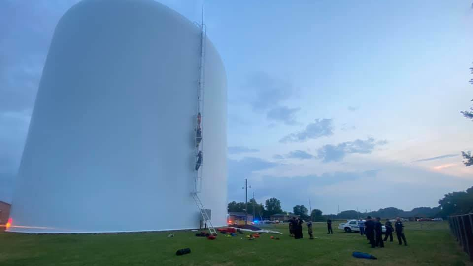 Athens, AL, firefighters rescued a woman who climbed into a 70-foot high water tank to swim Thursday.