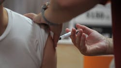 A person receives the COVID-19 vaccine in Camden, NJ, on Tuesday.