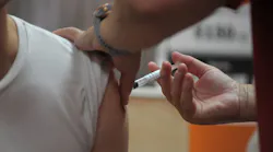 A person receives the COVID-19 vaccine in Camden, NJ, on Tuesday.
