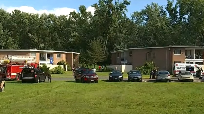 Firefighters rescued a critically injured woman who was trapped inside a burning apartment building in East Windsor, CT, on Monday.