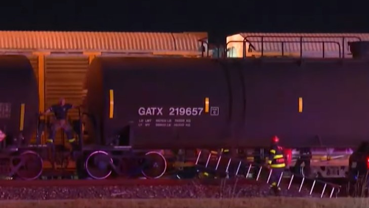 San Antonio, TX, firefighters rescued a man who was dangling from a train early Tuesday.
