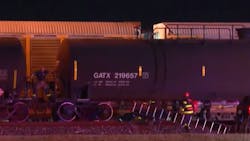 San Antonio, TX, firefighters rescued a man who was dangling from a train early Tuesday. San Antonio, TX, firefighters rescued a man who was dangling from a train early Tuesday.
