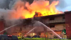 Firefighters battled a three-alarm fire that tore through a Tukwila, WA, apartment complex Tuesday.