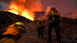 Firefighters make their way up a hill as they battle the El Dorado Fire in Yucaipa, CA, in September 2020.