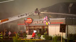 Firefighters pour water on a four-alarm fire that engulfed the Weaver Nut Company warehouse in Lancaster County, PA, late Wednesday and early Thursday.