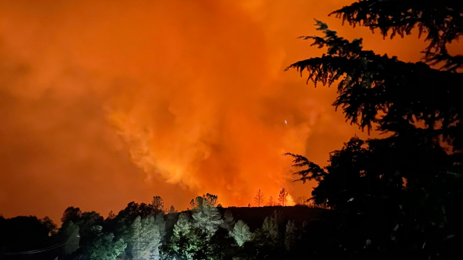 A smoky glow can be seen from the Caldor Fire burns as it approaches Lake Tahoe, CA, on Aug. 25, 2021.