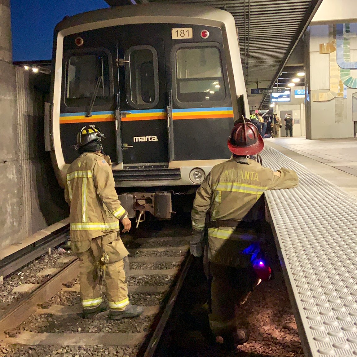 Atlanta firefighters rescued a man who was trapped under a MARTA rail system catwalk Wednesday.