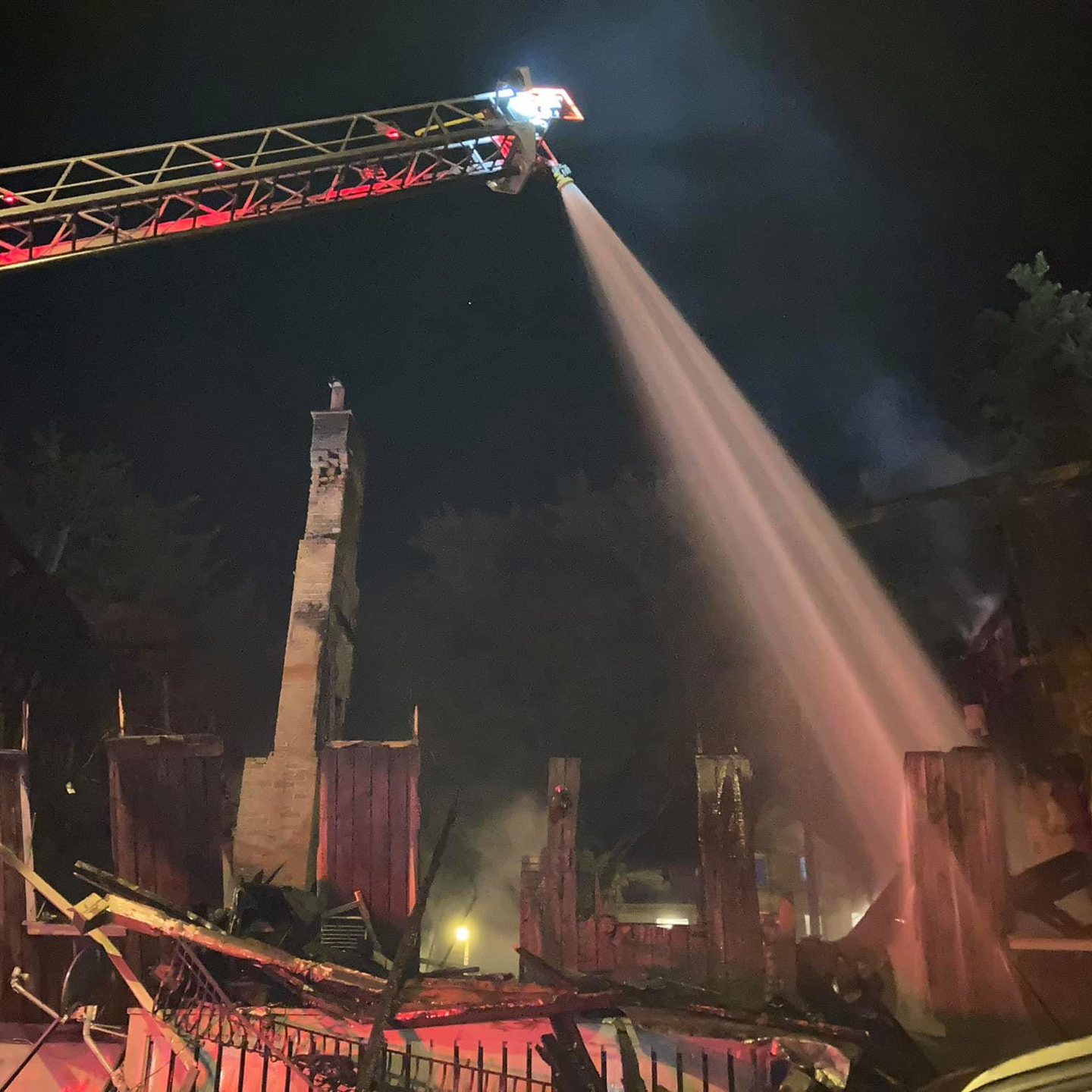 Firefighters from East Liverpool, OH, and other departments battled a residential fire that destroyed a house and damaged two others late Tuesday.