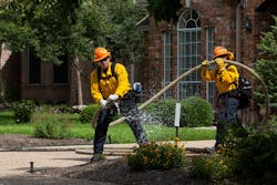 An Austin firefighter simulates a fire during a wildfire exercise in West Austin on Tuesday. An Austin firefighter simulates a fire during a wildfire exercise in West Austin on Tuesday.