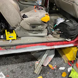Firefighters stabilized the vehicle before using O-cutters to cut the sign post above and below the patient and removed the vehicle's doors for total access.