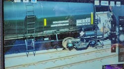 This photograph of a rail car was captured by a drone from one-half mile away. Such capability permits identification of products in rail cars and highway transportation vehicles without putting personnel in harm’s way. This photograph of a rail car was captured by a drone from one-half mile away. Such capability permits identification of products in rail cars and highway transportation vehicles without putting personnel in harm’s way.