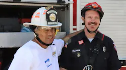 Steven Torrez, who faces the challenges of autism, is all smiles as he poses for a photo with his new friend, Firefighter Dillman of the Twin Falls Fire Department’s technical rescue team. The fire helmet that Steven is wearing was recently donated by Cairns Helmets to Courageous Kids Climbing.