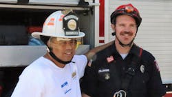 Steven Torrez, who faces the challenges of autism, is all smiles as he poses for a photo with his new friend, Firefighter Dillman of the Twin Falls Fire Department’s technical rescue team. The fire helmet that Steven is wearing was recently donated by Cairns Helmets to Courageous Kids Climbing. Steven Torrez, who faces the challenges of autism, is all smiles as he poses for a photo with his new friend, Firefighter Dillman of the Twin Falls Fire Department’s technical rescue team. The fire helmet that Steven is wearing was recently donated by Cairns Helmets to Courageous Kids Climbing.