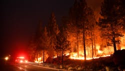 Firefighters battle the Caldor Fire along Hwy. 89 west of Lake Tahoe, CA, on Thursday, Sept. 2, 2021.