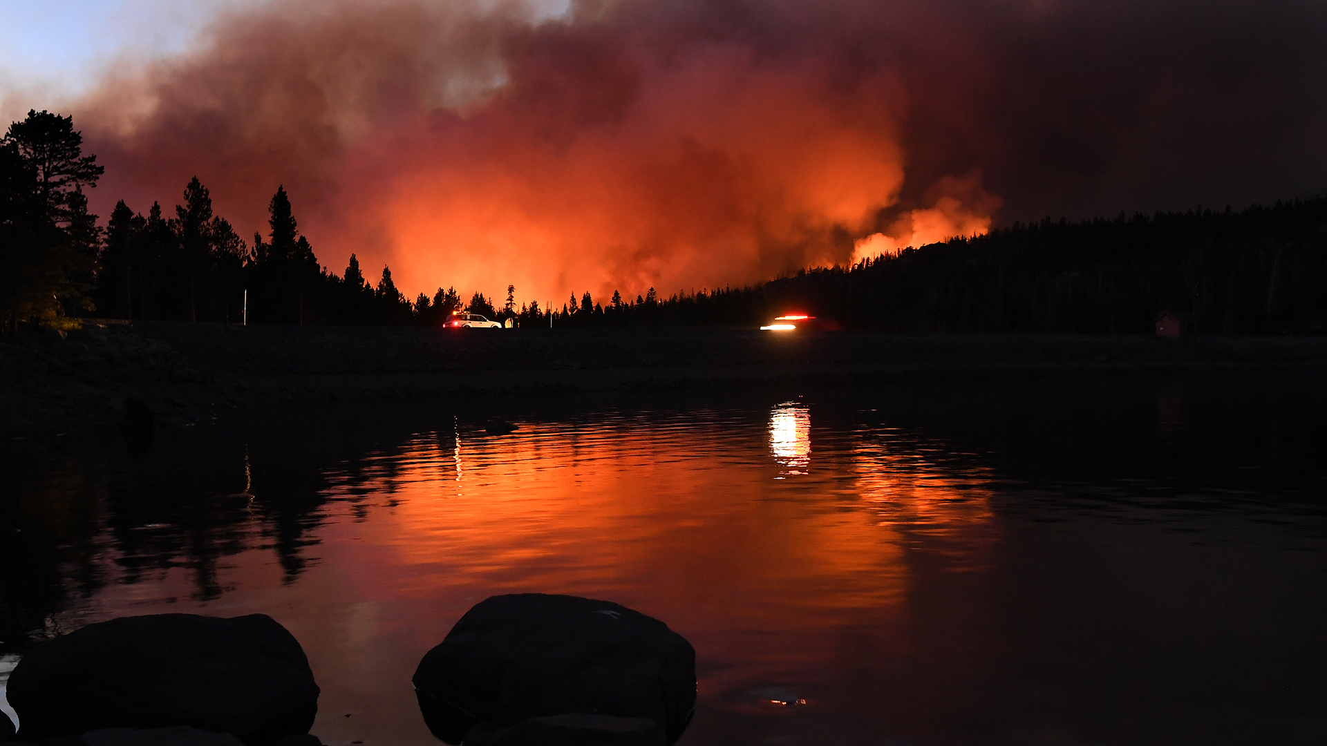 The Caldor Fire reflects off Caples Lake on Sept. 1, 2021 near Lake Tahoe, CA.
