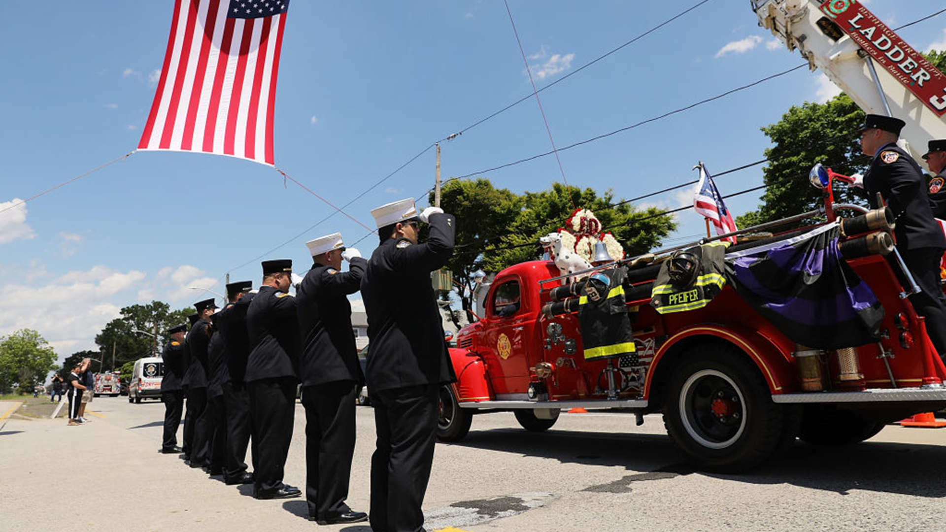 The casket of retired FDNY firefighter Ray Pfeifer drives away from a church on an antique fire truck on June 2, 2017 in Hicksville, NY. Pfeifer fought a years-long battle with cancer attributed to his work at Ground Zero and was instrumental in getting lawmakers to pass health-related legislation for 9/11 responders.