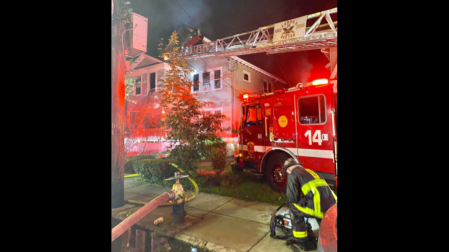 Two Boston firefighters and one residents were injured in the overnight fire.