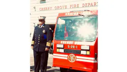 Former Cherry Grove Fire Department Chief Lyn Hutton poses next to the department's custom mini-pumper during a wet-down ceremony on Sept. 25, 2021. Former Cherry Grove Fire Department Chief Lyn Hutton poses next to the department's custom mini-pumper during a wet-down ceremony on Sept. 25, 2021.