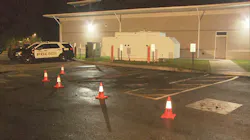 An area is coned off where two police cruisers were destroyed in a fire in Dracut, MA, on Sept. 15, 2021. An area is coned off where two police cruisers were destroyed in a fire in Dracut, MA, on Sept. 15, 2021.