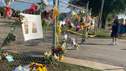 Flowers and photos hang on a gate outside the Ponderosa Pet Resort in Georgetown, TX, after 75 dogs being boarded there perished in a fire on Saturday, Sept. 18, 2021. Flowers and photos hang on a gate outside the Ponderosa Pet Resort in Georgetown, TX, after 75 dogs being boarded there perished in a fire on Saturday, Sept. 18, 2021.