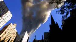 Smoke spews from a tower of the World Trade Center on Sept. 11, 2001, after two hijacked airplanes hit the twin towers in a terrorist attack on New York City.