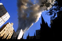Smoke spews from a tower of the World Trade Center on Sept. 11, 2001, after two hijacked airplanes hit the twin towers in a terrorist attack on New York City.