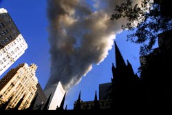 Smoke spews from a tower of the World Trade Center on Sept. 11, 2001, after two hijacked airplanes hit the twin towers in a terrorist attack on New York City. Smoke spews from a tower of the World Trade Center on Sept. 11, 2001, after two hijacked airplanes hit the twin towers in a terrorist attack on New York City.