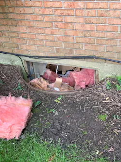 When firefighters took out some of the basement windows on the Charlie side of the house, they had to pull insulation in the process.