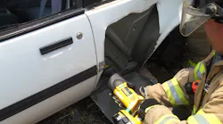 Photo 3: For the third-door-full-removal procedure, after “skinning” the rear panel of the vehicle to produce better visibility of the area to be cut and removed, use a reciprocating saw to cut the panel along the outline of the rear seat. A good blade can make the difference in the operation of a reciprocating saw.