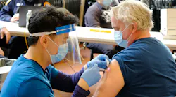 An FDNY firefighter receives a dose of the Moderna COVID-19 vaccine in Brooklyn in August 2021.