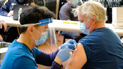 An FDNY firefighter receives a dose of the Moderna COVID-19 vaccine in Brooklyn in August 2021.