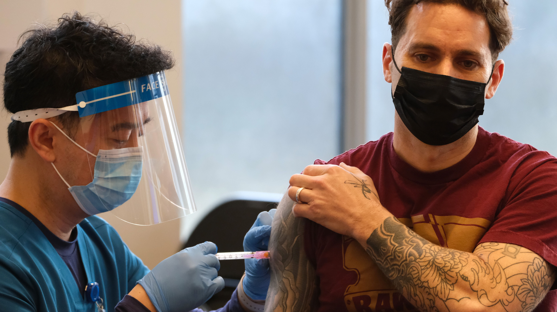 An FDNY firefighter receives a dose of the Moderna COVID-19 vaccine at FDNY headquarters in Brooklyn on Dec. 20, 2020.