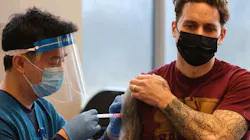 An FDNY firefighter receives a dose of the Moderna COVID-19 vaccine at FDNY headquarters in Brooklyn on Dec. 20, 2020.