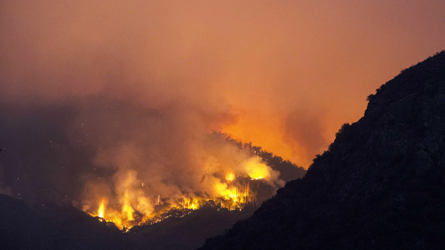 A section of the KNP Complex burns on a hillside near the entrance to Sequoia National Park in Three Rivers, CA, on Sept. 15, 2021.
