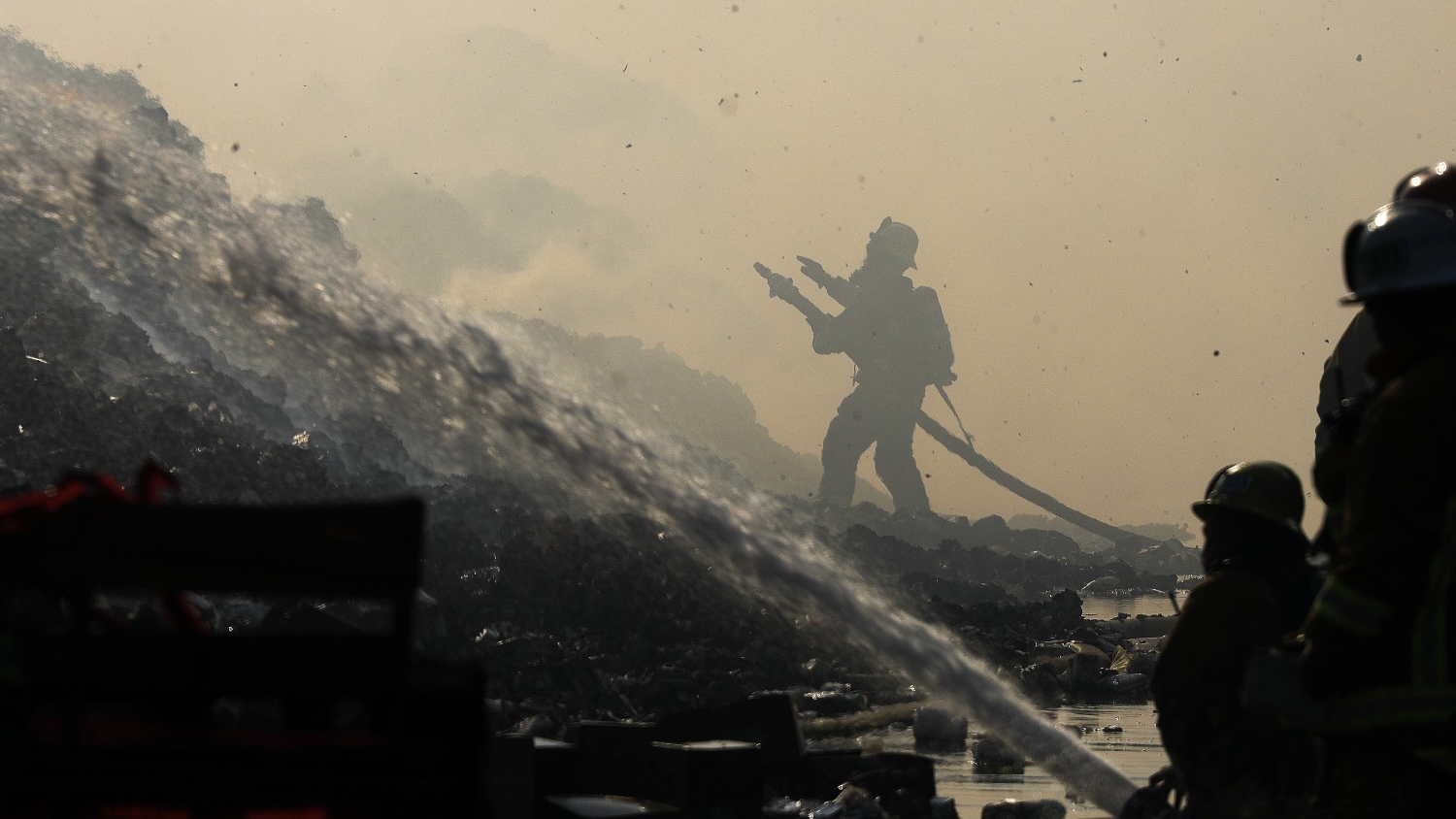 Fire crews battle a warehouse fire in Carson, CA, on Thursday, Sept. 30, 2021.