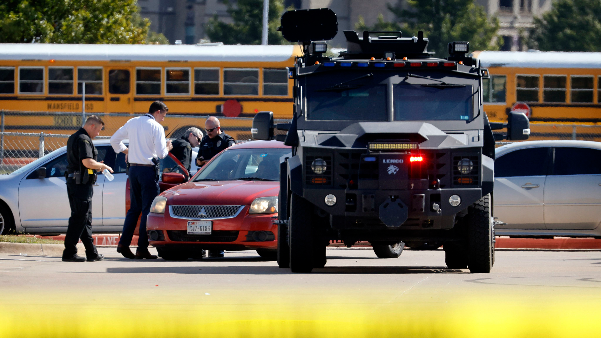 Emergency responders work the scene of a school shooting in Arlington, TX, on Wednesday, Oct. 6, 2021.