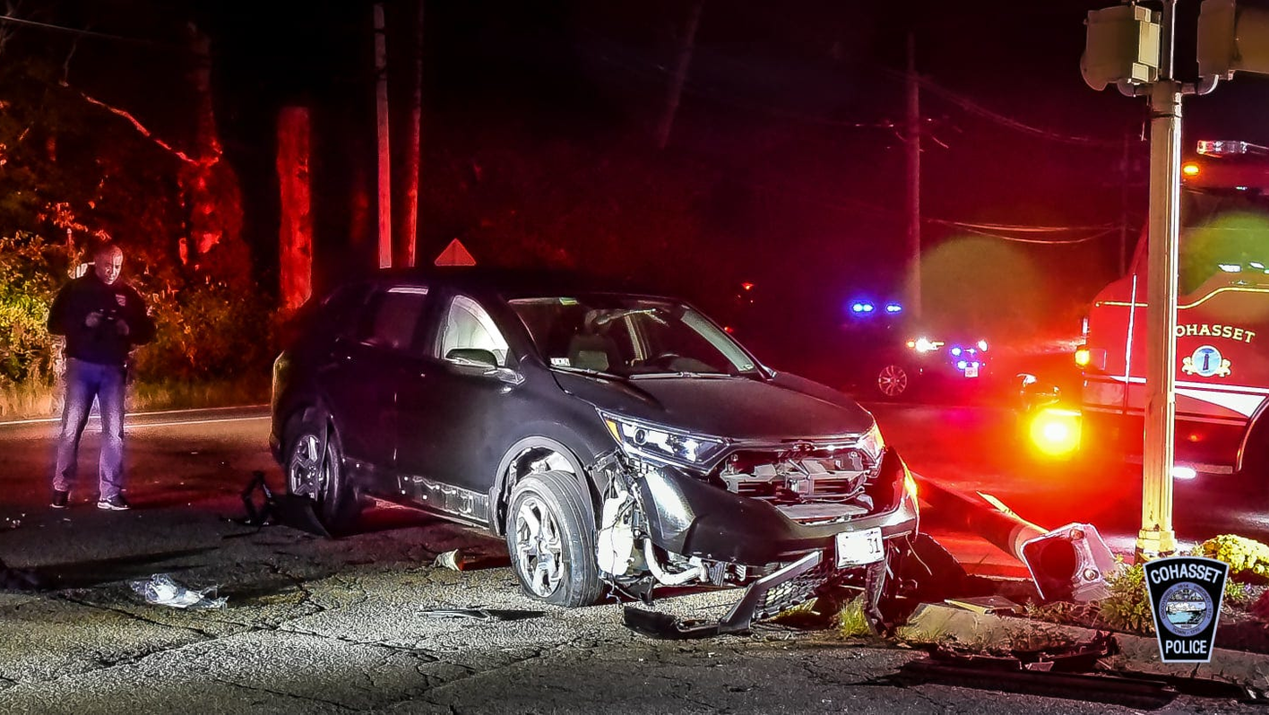 The scene of a crash that caused life-threatening injuries to a motorcycle rider who became pinned under an SUV in Cohasset, MA, on Tuesday, Oct. 12, 2021.