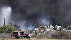 Firefighters work to extinguish a fire at a junk yard in Otay Mesa on Saturday. Firefighters work to extinguish a fire at a junk yard in Otay Mesa on Saturday.