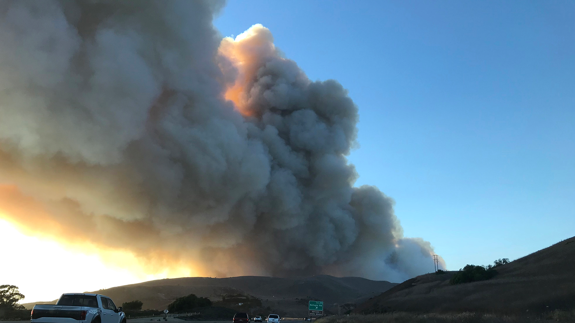 Smoke fills the sky as the Alisal Fire burns in the distance on Monday, Oct. 11, 2021, in Santa Gaviota Coast, CA.
