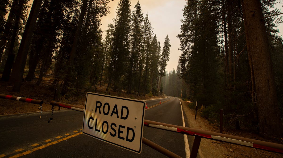 A gate is closed near the entrance to California&apos;s Sequoia National Park as the KNP Complex Fire continues to threaten groves of giant sequoia trees.