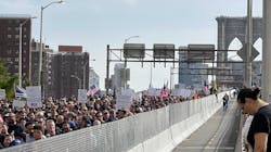 Hundreds of New York City municipal employees and their supporters march over the Brooklyn Bridge roadway on Monday, Oct. 25, 2021, in protest of the city&apos;s looming vaccine mandate.