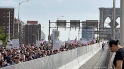 Hundreds of New York City municipal employees and their supporters march over the Brooklyn Bridge roadway on Monday, Oct. 25, 2021, in protest of the city's looming vaccine mandate. Hundreds of New York City municipal employees and their supporters march over the Brooklyn Bridge roadway on Monday, Oct. 25, 2021, in protest of the city's looming vaccine mandate.