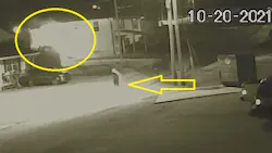 In this screen capture from security camera footage, a person wearing a hoodie can be seen running from a burning building in Fort Oglethorpe, GA, on Wednesday, Oct. 20, 2021. In this screen capture from security camera footage, a person wearing a hoodie can be seen running from a burning building in Fort Oglethorpe, GA, on Wednesday, Oct. 20, 2021.