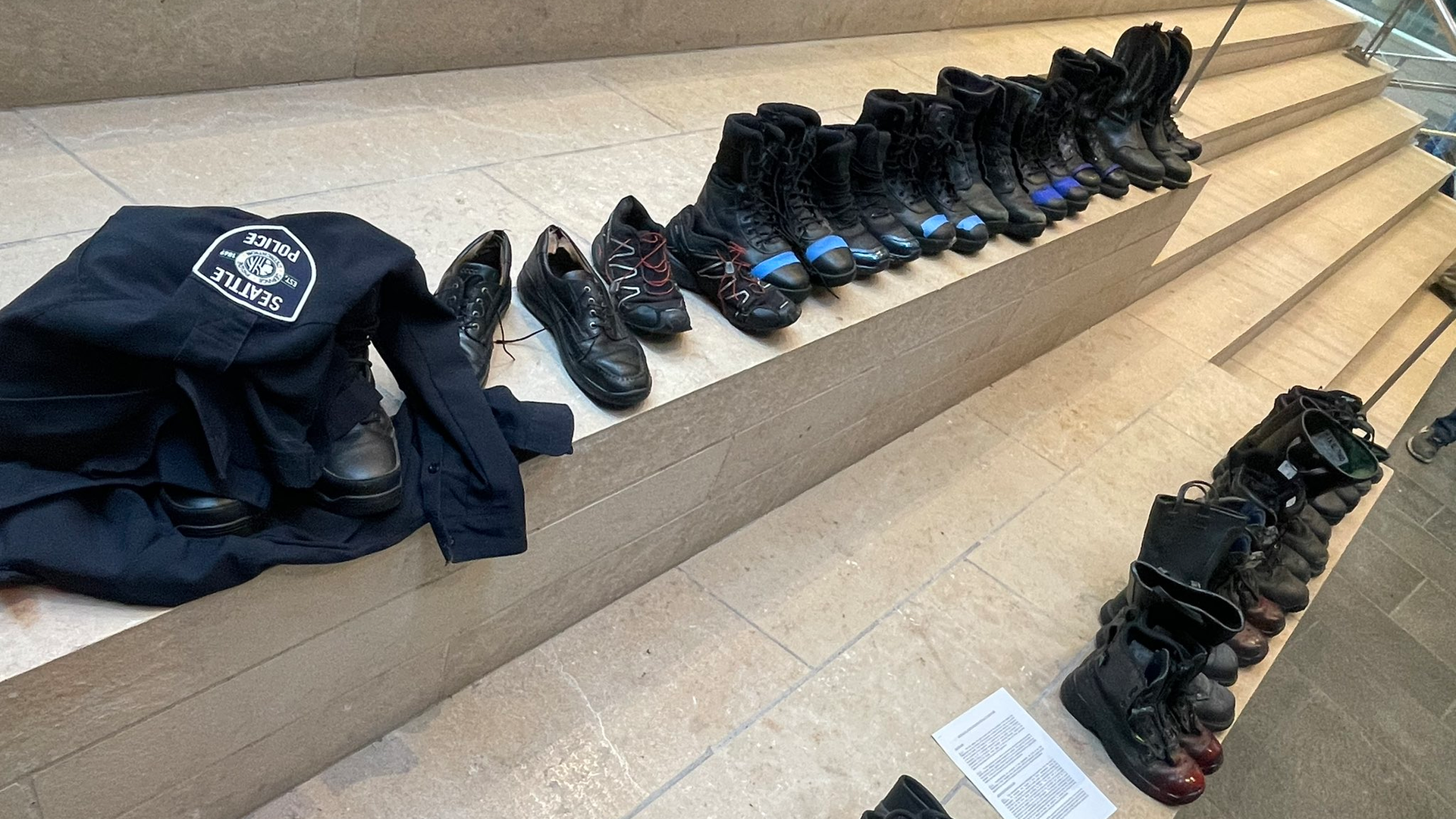 Pairs of boots placed at Seattle City Hall by firefighters protesting terminations related to the COVID-19 vaccine mandate on Tuesday, Oct. 19, 2021.