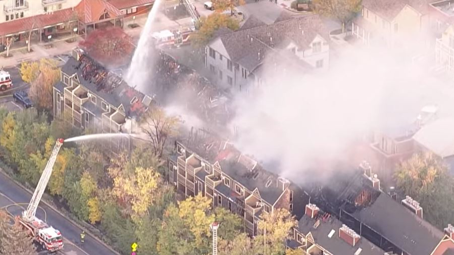 Smoke rises from a burning row of condominiums in Boulder, CO, on Tuesday, Oct. 19, 2021.