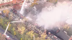 Smoke rises from a burning row of condominiums in Boulder, CO, on Tuesday, Oct. 19, 2021.