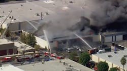 A warehouse containing a suspected marijuana grow burns in the Canoga Park section of Los Angeles on Monday, Oct. 18, 2021. A warehouse containing a suspected marijuana grow burns in the Canoga Park section of Los Angeles on Monday, Oct. 18, 2021.
